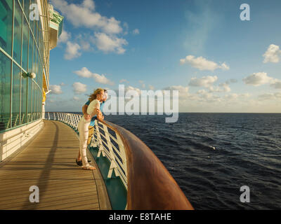 Caucasian couple admiring view from boat deck Stock Photo