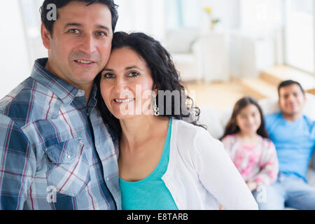 Hispanic family smiling together Stock Photo