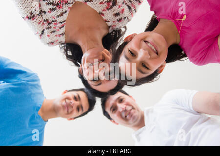 Low angle view of Hispanic family smiling Stock Photo