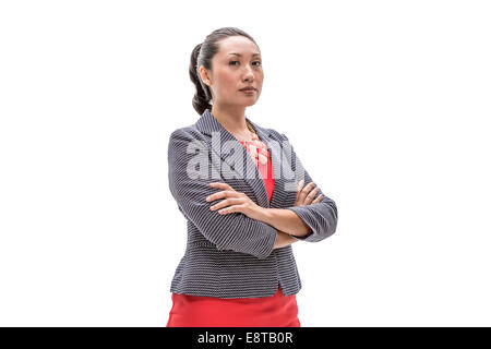 Pacific Islander businesswoman standing with arms crossed Stock Photo