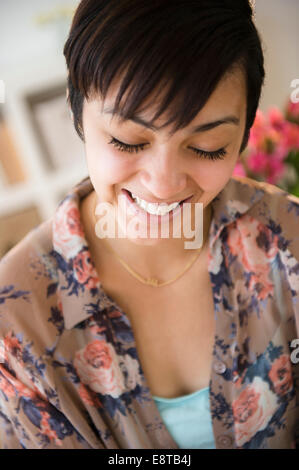 Close up of mixed race woman's smiling face