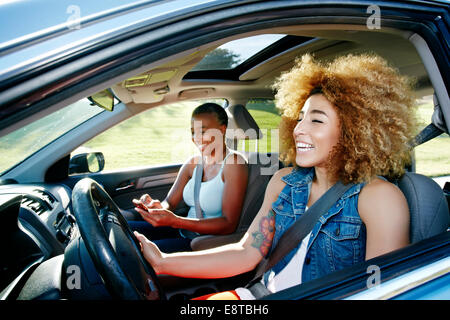 Daughter driving mother in car Stock Photo