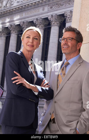 Caucasian business people standing in city, New York City, New York, United States Stock Photo