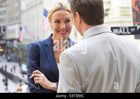 Caucasian business people talking in city, New York City, New York, United States Stock Photo