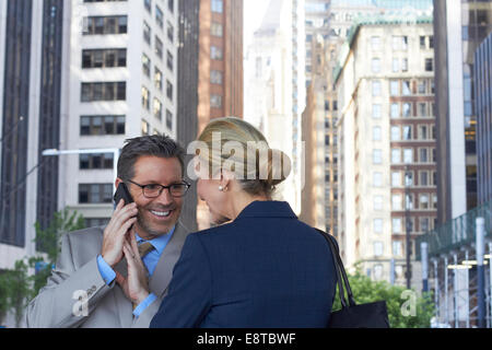 Caucasian business people talking in city, New York City, New York, United States Stock Photo