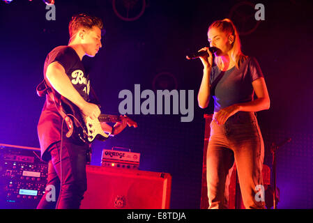 Berlin, Germany. 05th Oct, 2014. Singer Hannah Reid and guitarist Dan Rothman from the British band London Grammar perform in the Columbiahalle in Berlin, Germany, 05 October 2014. Photo: Jason Harrell/dpa/Alamy Live News Stock Photo