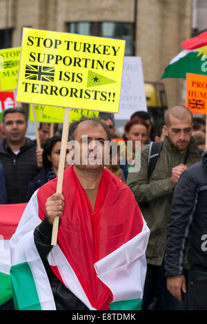 'Save Kobane' & Protect humanity protesters; A protest march  through Liverpool city centre to demonstrate against terrorist group ISIS. Around 300 Kurdish people marched along Church Street, Bold Street and Renshaw Street before picketing outside Lime St Station. Sabiha Soylu took part in the march because she feels more needs to be done to help Kurdish fighters - who are battling with heavily-armed ISIS mililtants. Stock Photo