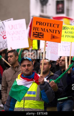 'Save Kobane' & Protect humanity protesters; A protest march  through Liverpool city centre to demonstrate against terrorist group ISIS. Around 300 Kurdish people marched along Church Street, Bold Street and Renshaw Street before picketing outside Lime St Station. Sabiha Soylu took part in the march because she feels more needs to be done to help Kurdish fighters - who are battling with heavily-armed ISIS mililtants. Stock Photo