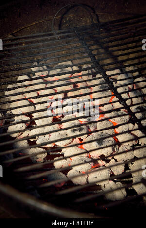 Hot empty barbecue grill with smoldering coals. Stock Photo