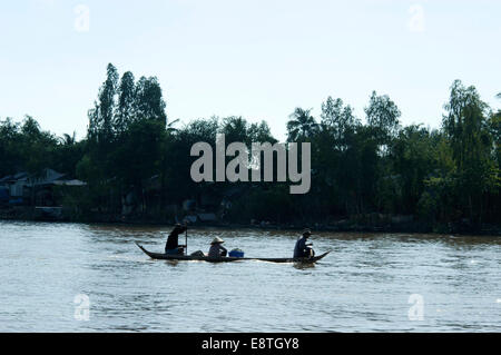 local people floating down a river in south east asia Stock Photo