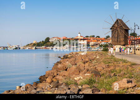 Coastal landscape with old windmill. Ancient town Nessebar, Bulgaria. Black Sea coast in sunny day Stock Photo