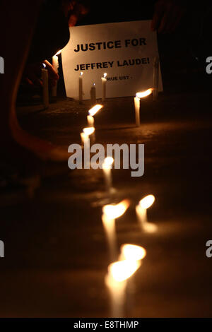 Manila, Philippines. 14th Oct, 2014. Activists light candles during a candlelighting rally in Manila, Philippines on Oct. 14, 2014. The Philippine government on Tuesday vowed justice for a Filipino transgender who was found dead in a hotel in Olongapo City in northern Philippines. A U.S. Marine, identified as Private First Class Joseph Scott Pemberton, was tagged as a possible suspect in the murder of Jeffrey Laude. Credit:  Rouelle Umali/Xinhua/Alamy Live News Stock Photo