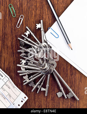 Keys on a keychain on a table Stock Photo