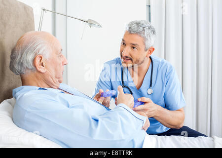 Caretaker Explaining Prescription To Senior Man Stock Photo