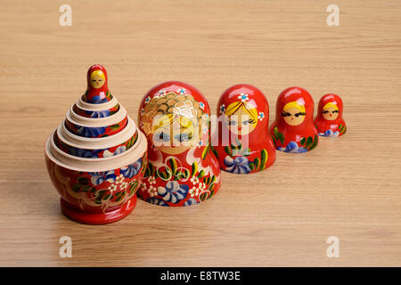 Line of five red Russian dolls opened up Stock Photo