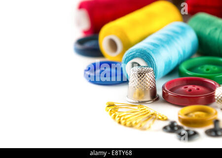 Tools for sewing and handmade: measurement, button, thimble, pins on white background Stock Photo