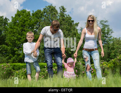 Portrait Of Happy Family In Garden Stock Photo