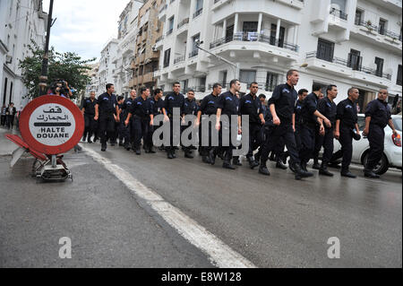 Algiers. 14th Oct, 2014. Algerian policemen take part in a public protest demanding better working conditions in the southern city of Ghardaia, in Algiers, capital of Algeria, Oct. 14, 2014. About 1,500 policemen took part in the demonstration in Ghardaia where clashes have been taking place for months between Arabs and Berbers on Monday. Credit:  Xinhua/Alamy Live News Stock Photo