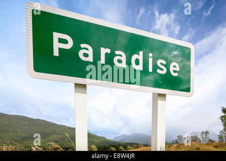 Paradise is a pastoral rural place in Otago region of New Zealand South Island. Road sign storm brewing in the distance. Stock Photo