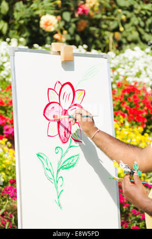 1 Indian man Painting at Canvas Stock Photo