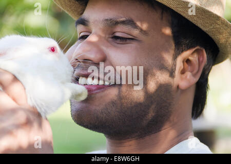 1 Indian Man holding with Rabbit Stock Photo