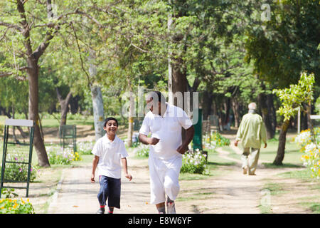 1 Indian Man Morning Walk With kid Stock Photo
