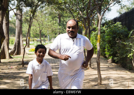 1 Indian Man Morning Walk With kid Stock Photo