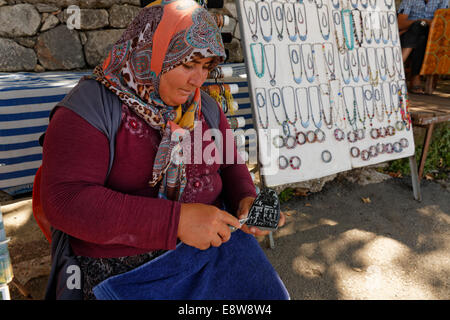 Woman carving a stone, ancient city of Tlos in the Xanthos Valley, Muğla Province, Lycia, Aegean, Turkey Stock Photo