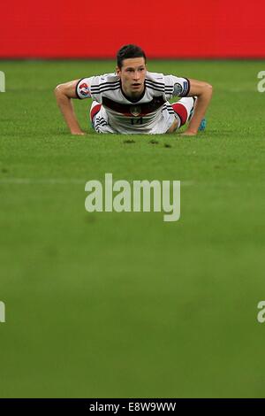 Gelsenkirchen, Germany. 14th Oct, 2014. Germany's Julian Draxler lies on the ground during the UEFA EURO 2016 qualifying soccer match between Germany and Ireland at Arena Auf Schalke in Gelsenkirchen, Germany, 14 October 2014. Photo: Fredrik von Erichsen/dpa/Alamy Live News Stock Photo