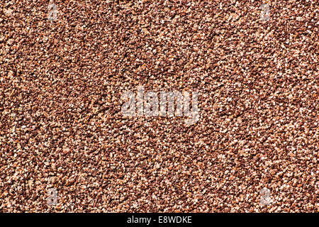 Coarse Grained Texture. Coarse grained texture of red and brown color. Coarse sand Stock Photo