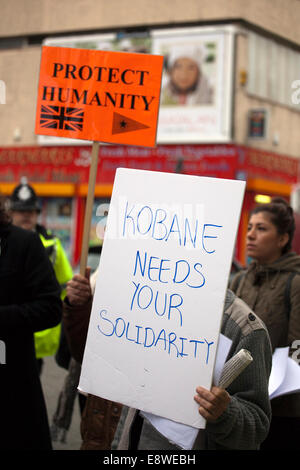 Anti-ISIS is a Terrorist placard; Protest at Lime Street Station, Liverpool, Merseyside, UK   Protesters march through Liverpool city centre to demonstrate against terrorist group ISIS. Around 300 protesters marched along Church Street, Bold Street and Renshaw Street before picketing outside Lime St Station.  Protestors waved flags with slogans such as 'Unite against ISIS terror in Kurdistan' & Save Kobane. The protests, organized by 'The People's Protection Units'- also known as YPG, lasted for two hours.  October 2014 Credit:  Cernan Elias/Alamy Live News Stock Photo