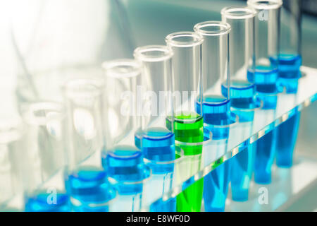 Close up of rack of test tubes with solution in lab Stock Photo