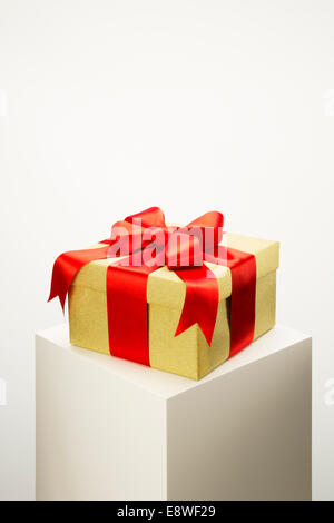 Close up of wrapped gift on pedestal Stock Photo