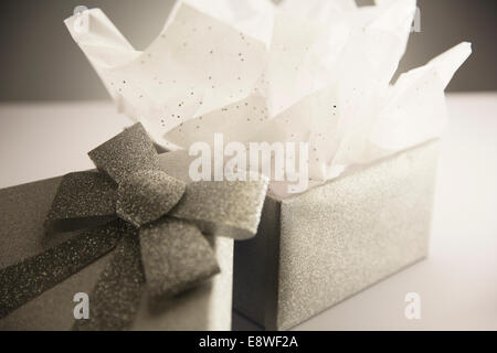 Close up of opened gift with tissue paper Stock Photo