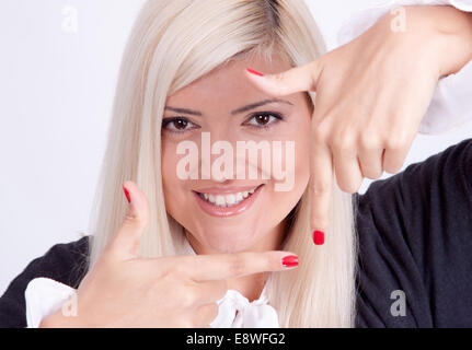 Girl making frame gesture with hands, isolated on white Stock Photo