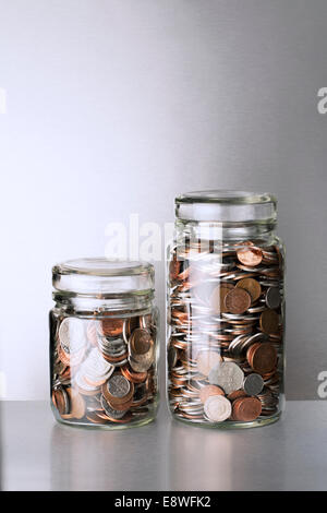 Change jars sitting on counter Stock Photo