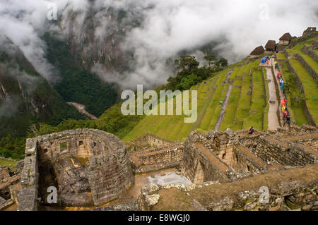 The sun temple located inside the archaeological complex of Machu Picchu. Machu Picchu is a city located high in the Andes Mount Stock Photo