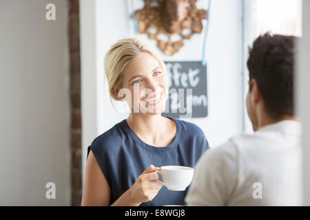 Couple having coffee together in cafe Stock Photo