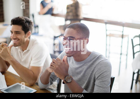 Businessmen at meeting in cafe Stock Photo