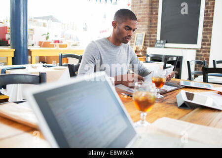 Businessman having lunch meeting in cafe Stock Photo