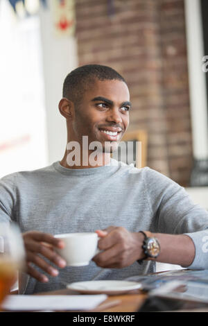 Man having coffee in cafe
