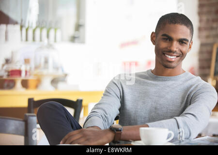 Man having coffee in cafe Stock Photo