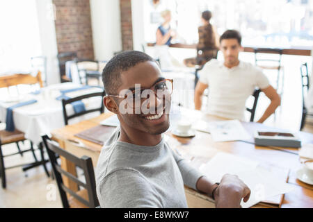 Businessmen looking at documents at meeting Stock Photo