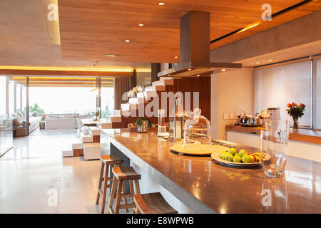 Counter, steps and sofa in open modern house Stock Photo