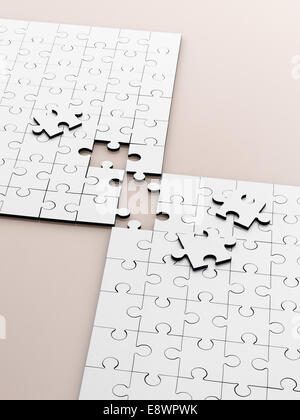 Close up of connecting puzzle with scattered pieces Stock Photo