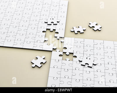 Close up of connecting puzzle with scattered pieces Stock Photo