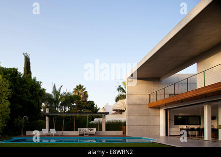 Double height balcony facade and swimming pool of D House, Israel, Middle East. Stock Photo