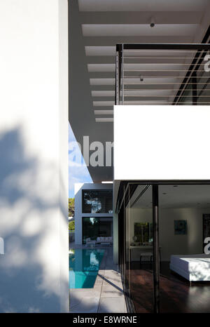 Double height exterior facade of Dahan House with view from poolside into bedroom, Israel, Middle East. Stock Photo