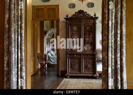 View through curtains to cabinet in La Maison Creole a French colonial house, Eureka house, House of 109 doors in Moka, Mauritius.