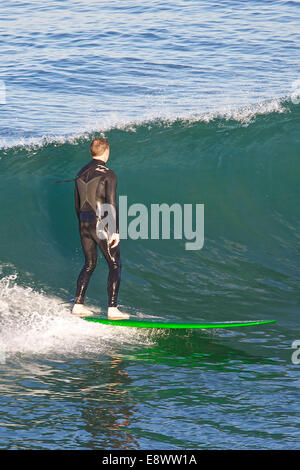 Surfing At Sunrise. Hermosa Beach, California. Stock Photo